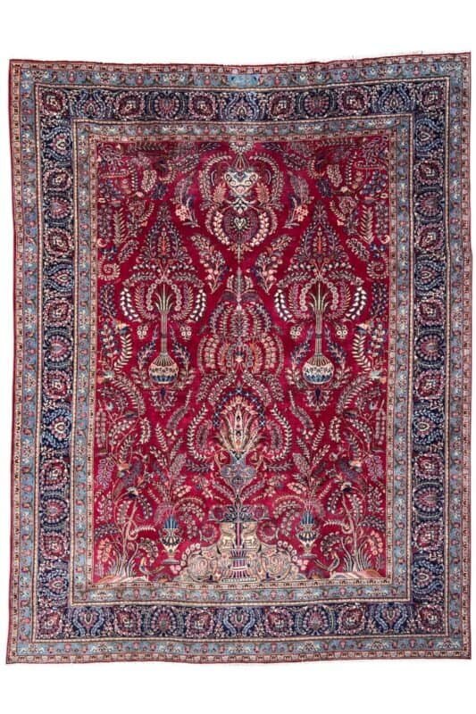alt="Antique Mashhad Persian carpet with floral motifs, hand-knotted wool, 1950s