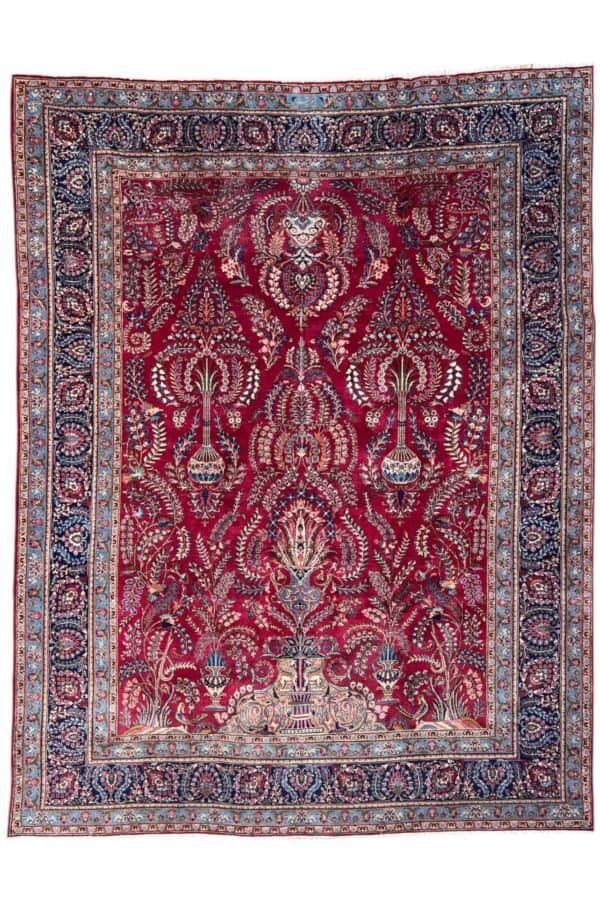 alt="Antique Mashhad Persian carpet with floral motifs, hand-knotted wool, 1950s
